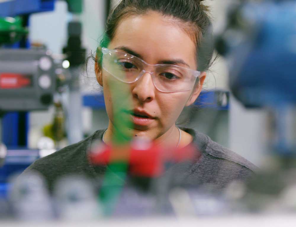 Instrumentation student in safety glasses