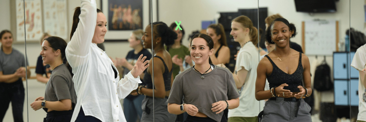 Dance instructor with student at San Jac