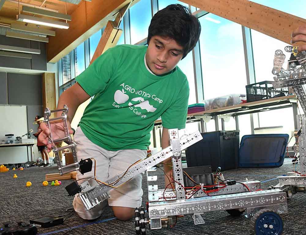 Young boy with robot