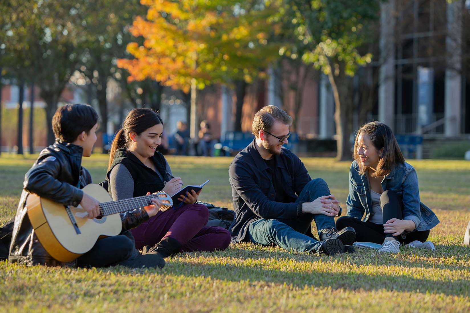 students talking on lawn